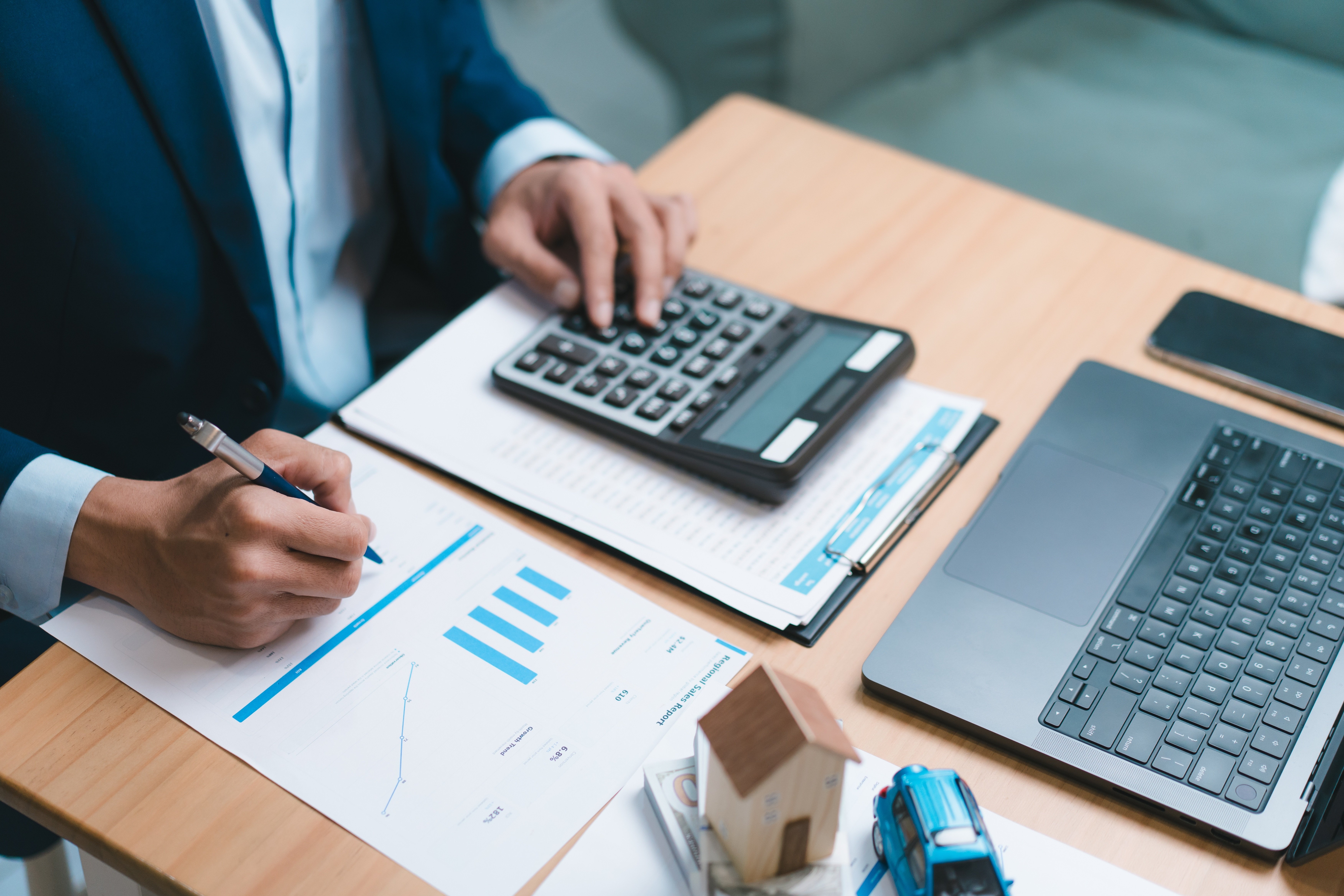 Financial Advisor Reviewing Tax Planning Documents for a High-Income Family