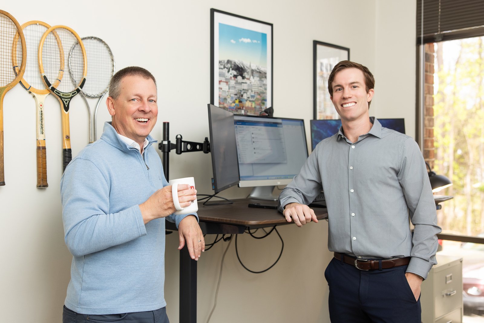 Two Stancil CPAs and Advisors team members collaborating in an office workspace.
