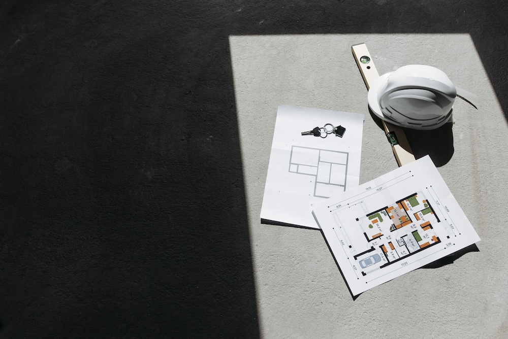 construction plans and hard hat