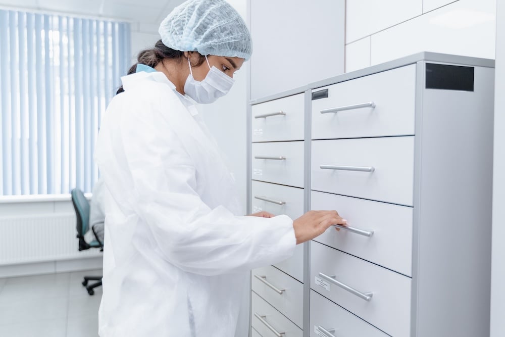 medical professional looking in drawers at a medical practice in raleigh nc