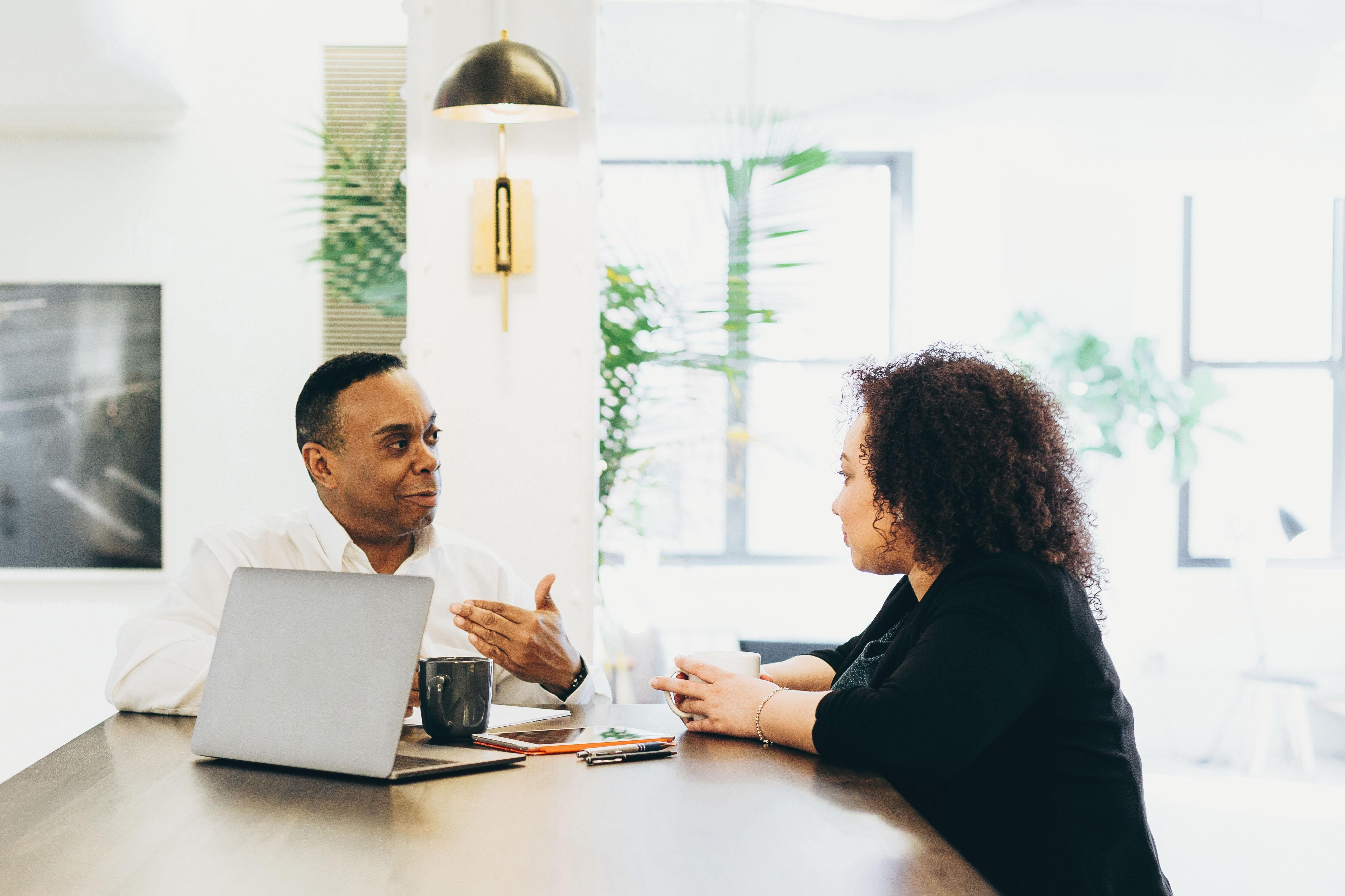 Business owner meeting with a tax advisor to discuss tax planning and preparation strategies in Raleigh, North Carolina.