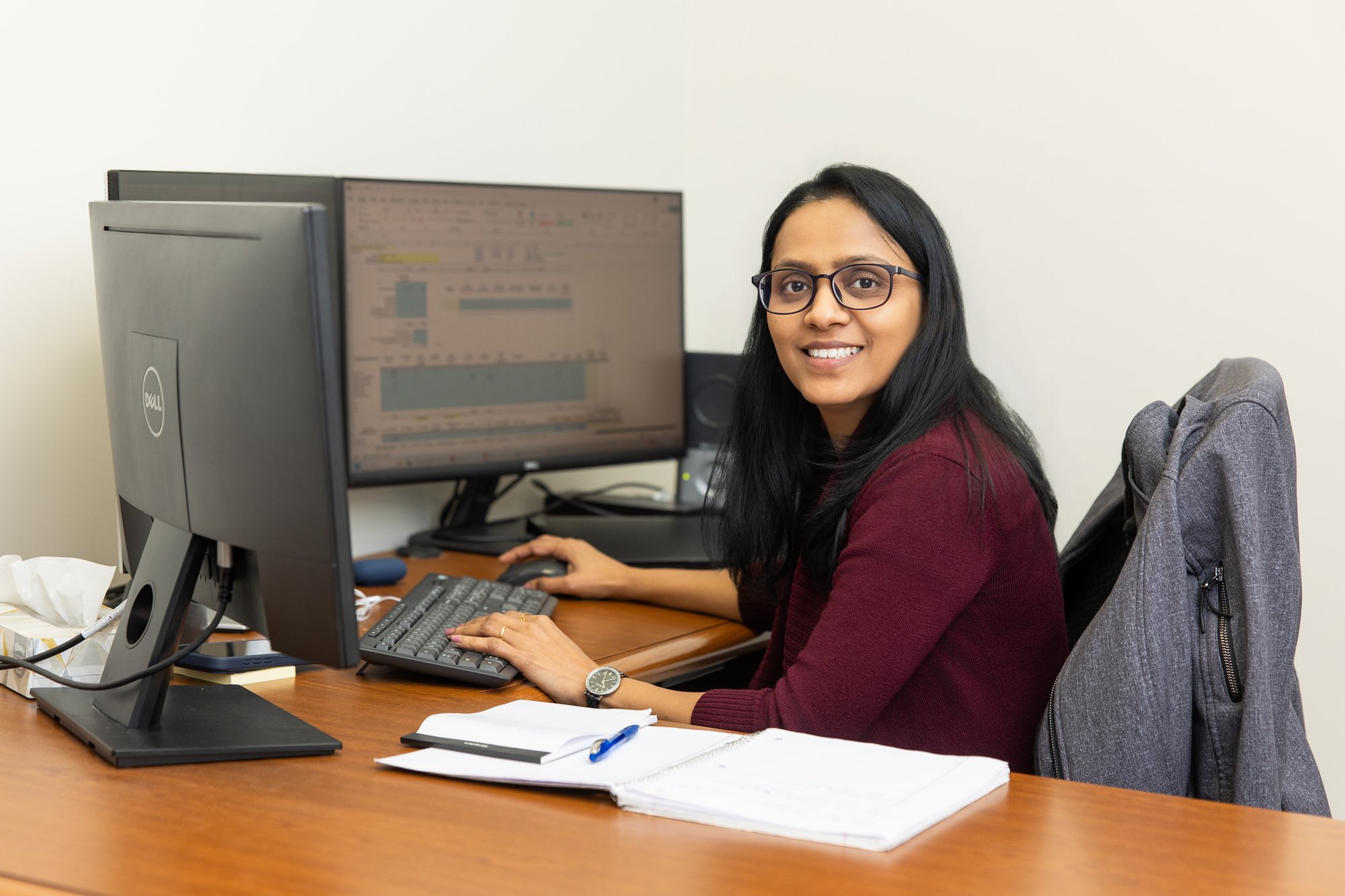Stancil CPA team member working at her desk in the Raleigh office.