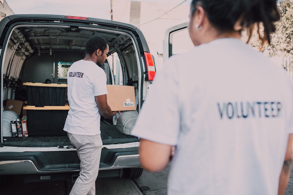 Nonprofit volunteers moving boxes